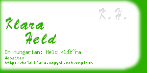 klara held business card